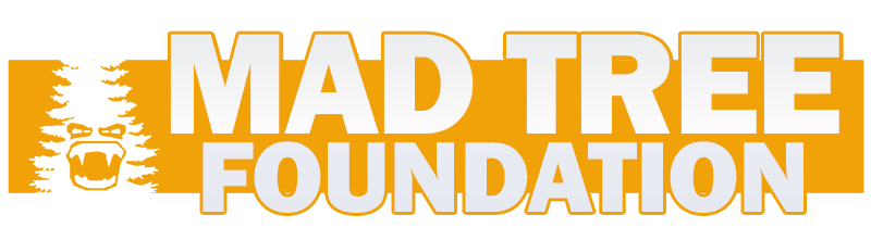 Logo for the Mad Tree Foundation, featuring bold white and orange text. A stylized tree with an angry bear face on the left side is integrated into the design.