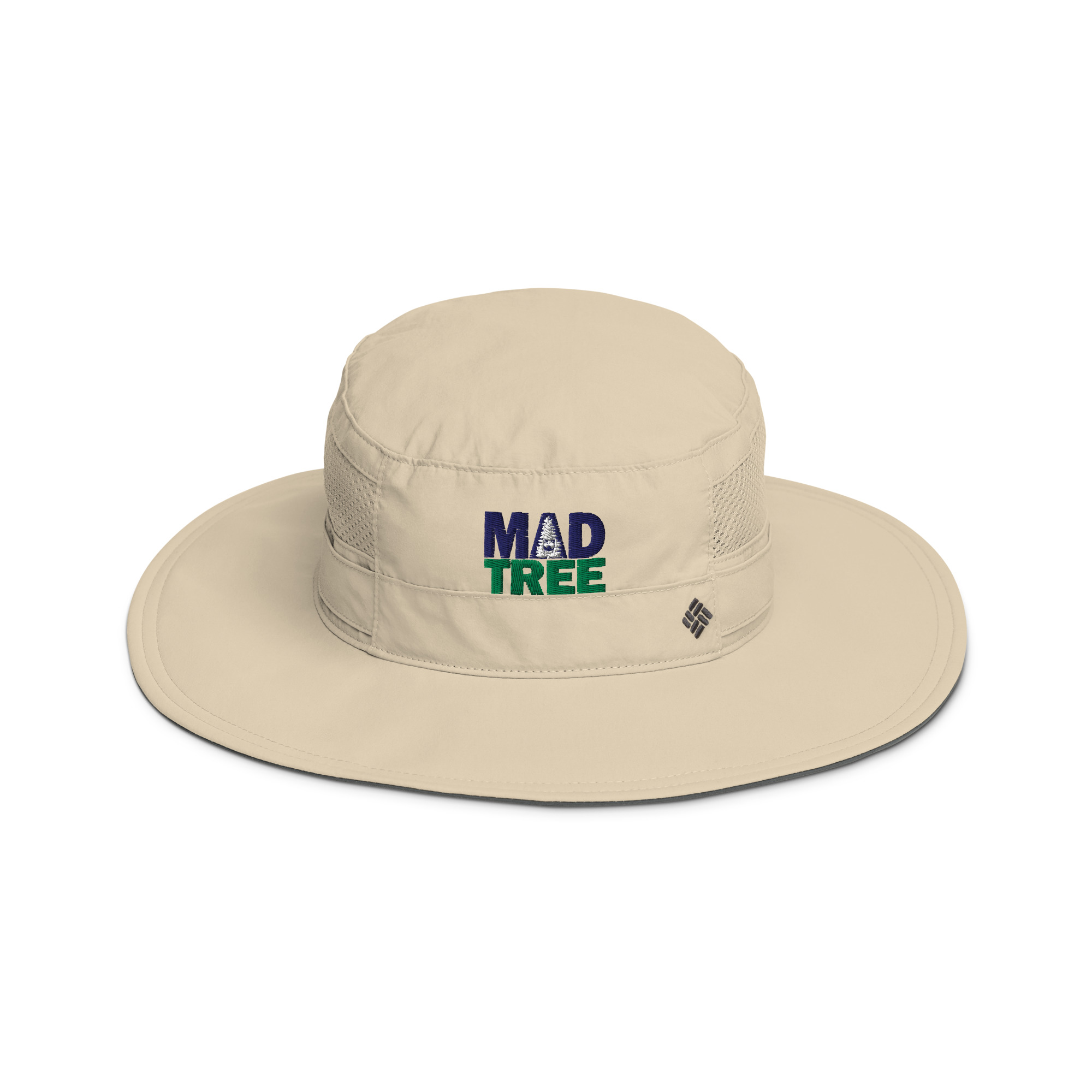 The Columbia booney hat - Mad Tree is a beige wide-brimmed hat featuring MAD TREE embroidered in dark blue and green on the front, mesh side ventilation panels, and a small black logo tag on the brim.