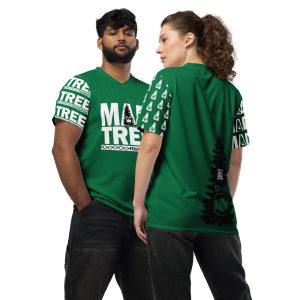 Two people wear Mad Tree Unisex Sports Jersey - Green. The man faces forward, hands in pockets. The woman is sideways, displaying the back design with a tree and face graphic. Both pair the green jersey with dark jeans.